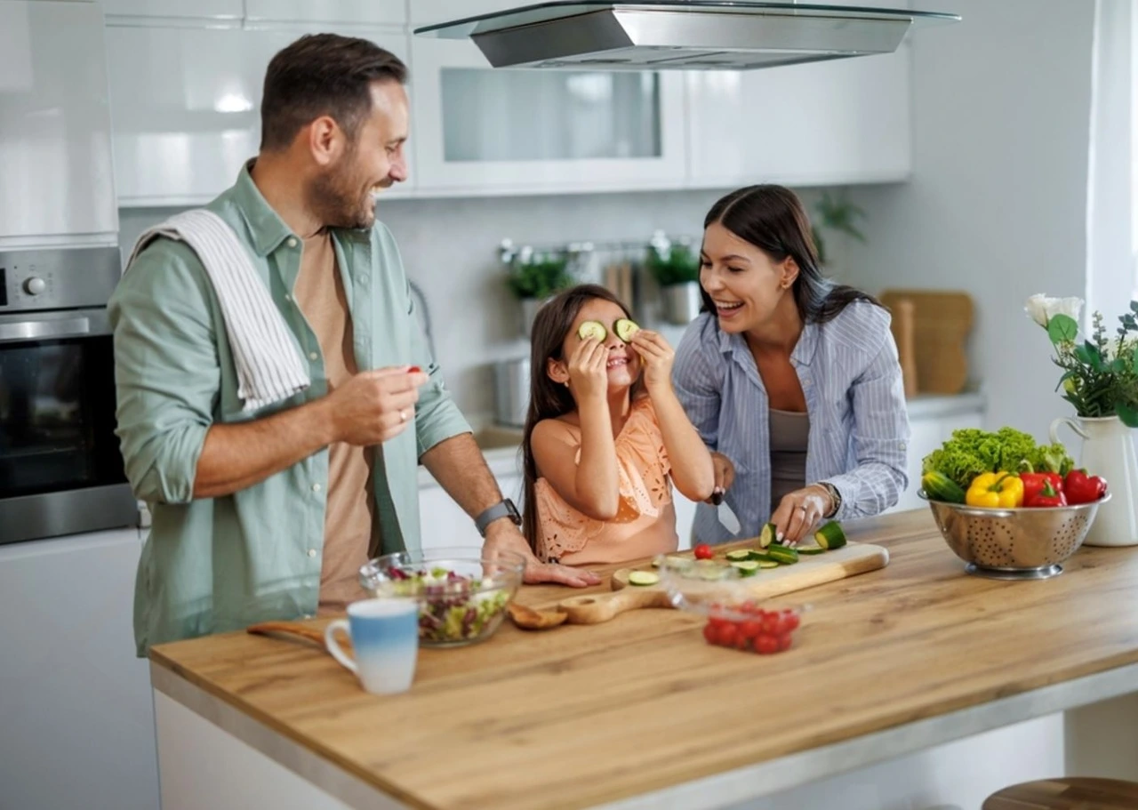 Family cooking together in kitchen