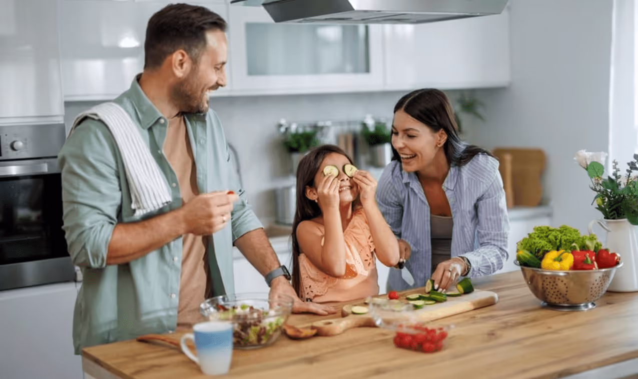 Happy family cooking together in kitchen